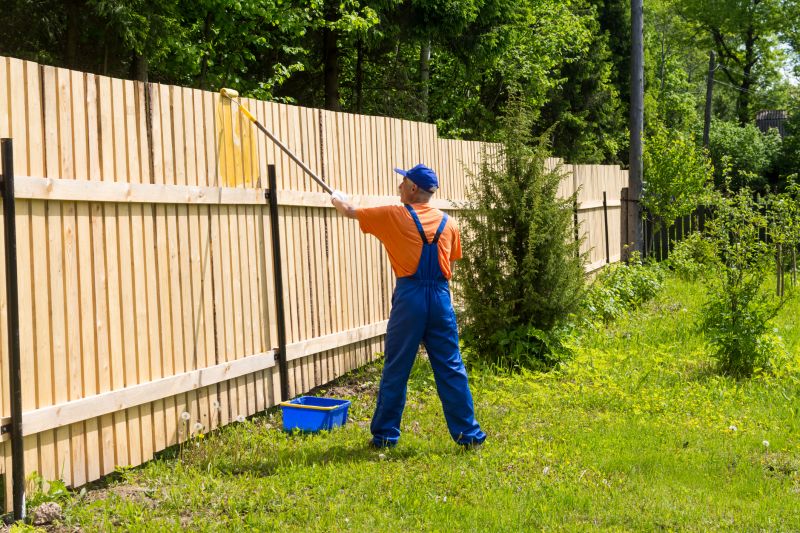 Painting Fence in Summer